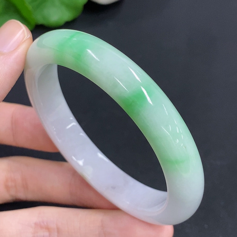 Jadeite round bracelet with mineral inclusions, approximately 44g, size 55, featuring smooth jadeite beads and natural mineral details.