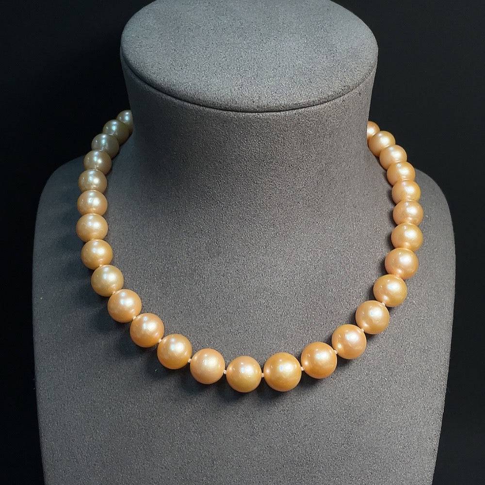 Huiliu Certified Pearl Strand featuring 10.8-13.1mm white pearls, natural luster, strung together for elegant jewelry.