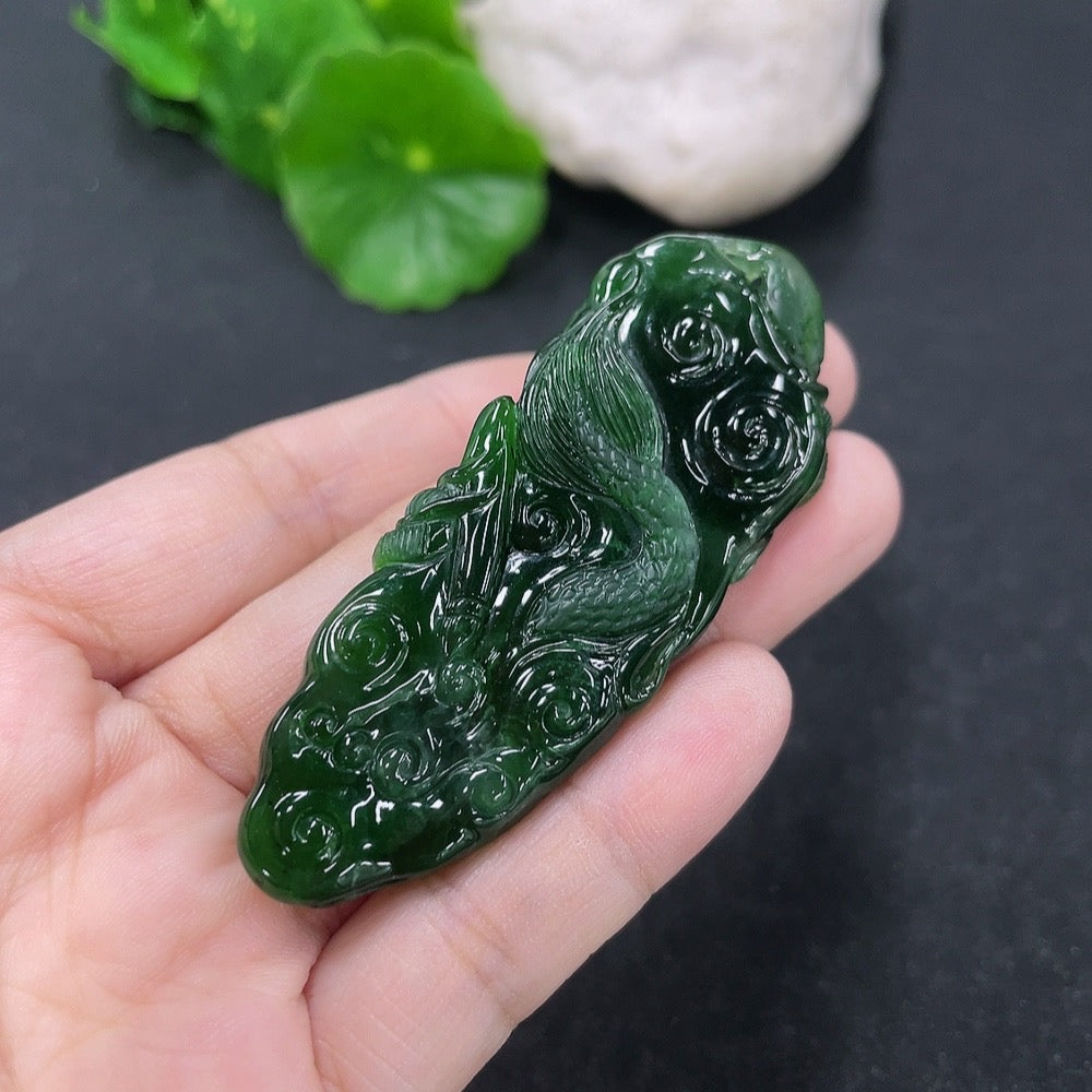 Jadeite pendant featuring a detailed dragon plaque in green jade, weighing approximately 21.95g, crafted by HKHQ.