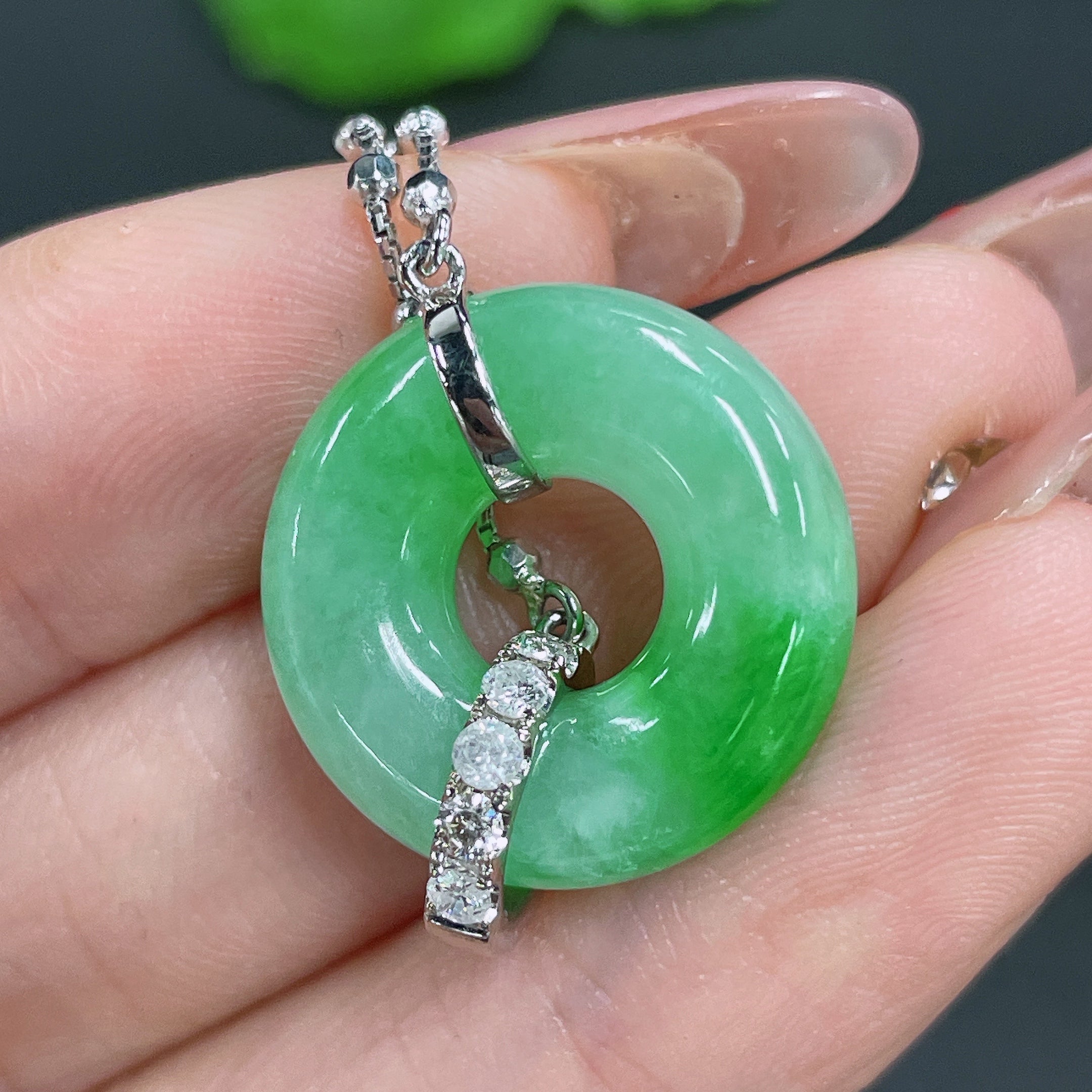 Jadeite pendant with 18k gold inlay and diamonds, crafted by HUILIU HQ, showcasing a polished jade stone with intricate gold and diamond details.