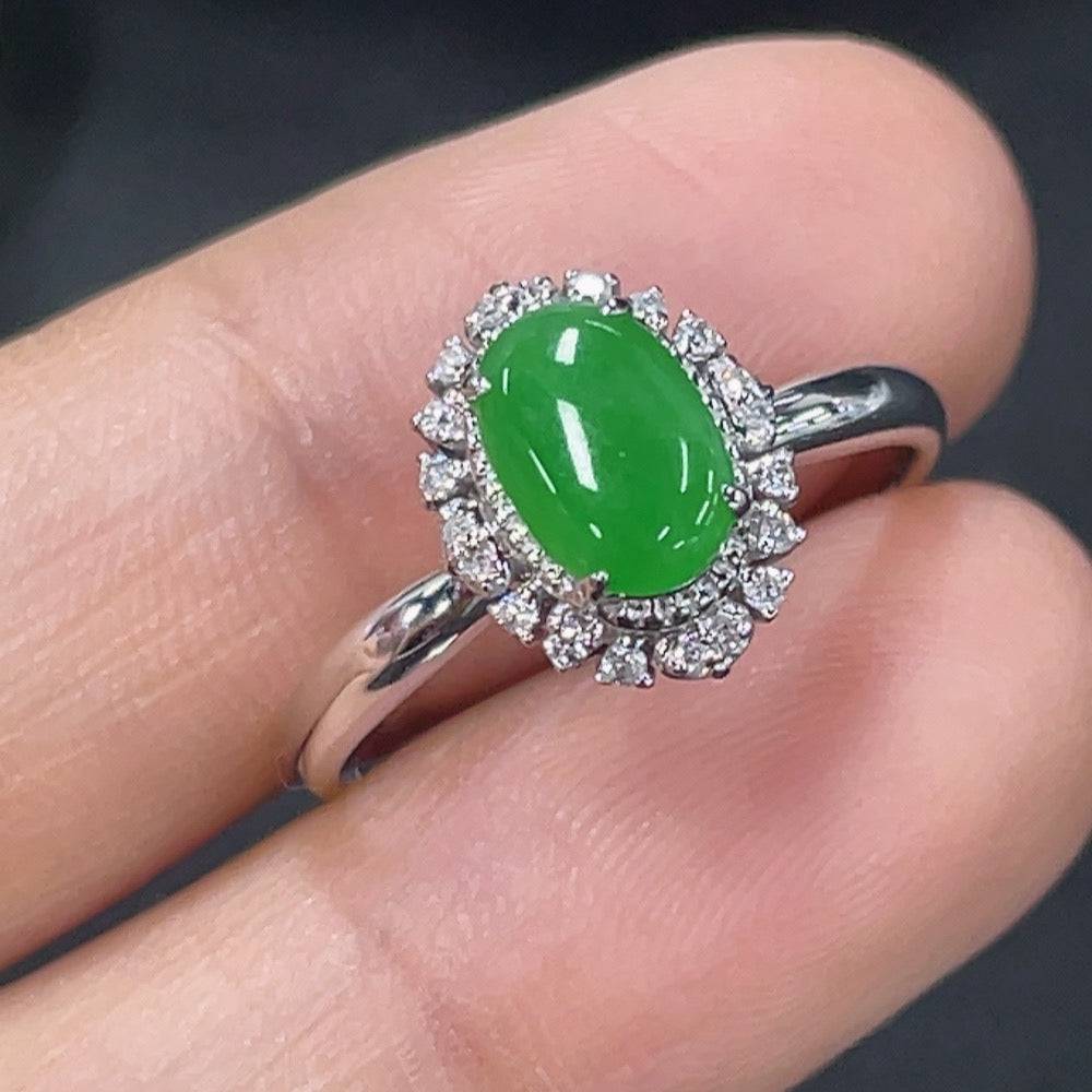 HUILIU HQ jadeite inlaid ring with diamond accents, showcasing a polished jade gemstone and intricate metalwork.