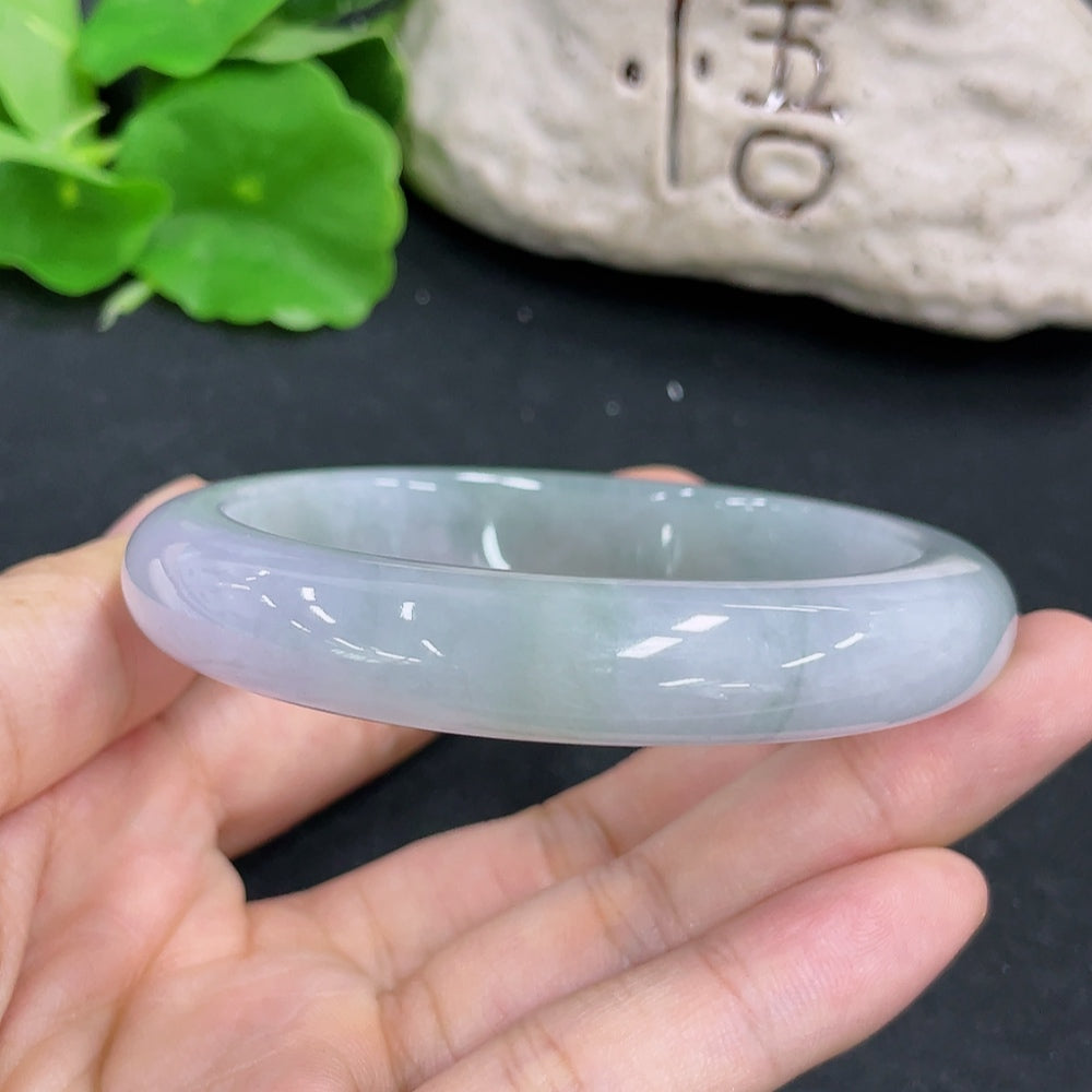 HKHQ jadeite round bangle in size 58, showcasing smooth, polished jadeite with a natural green hue and elegant circular design.