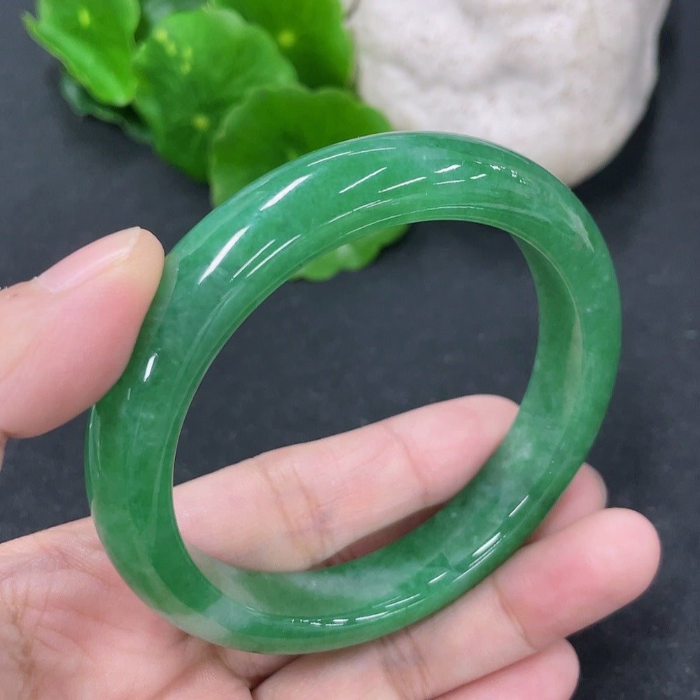 HKHQ jadeite round bangle with 53.8mm diameter, weighing approximately 49.13g, showcasing smooth, polished jadeite surface.