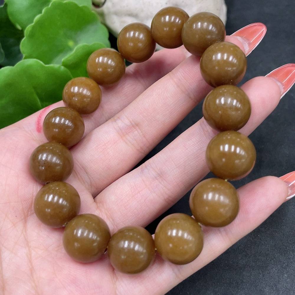 Huiliu certified Hetian Jade bracelet with 13.6mm smooth jade beads, showcasing elegant craftsmanship and natural green hues.