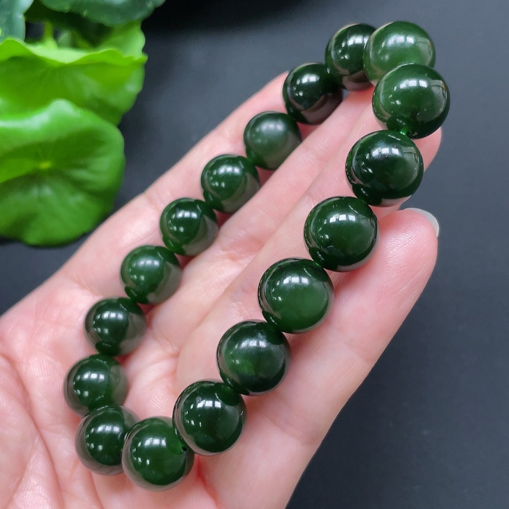 HKHQ Hetian Jade bracelet with 11.9mm beads, totaling approximately 45.24 grams, showcasing smooth, polished green jade stones.