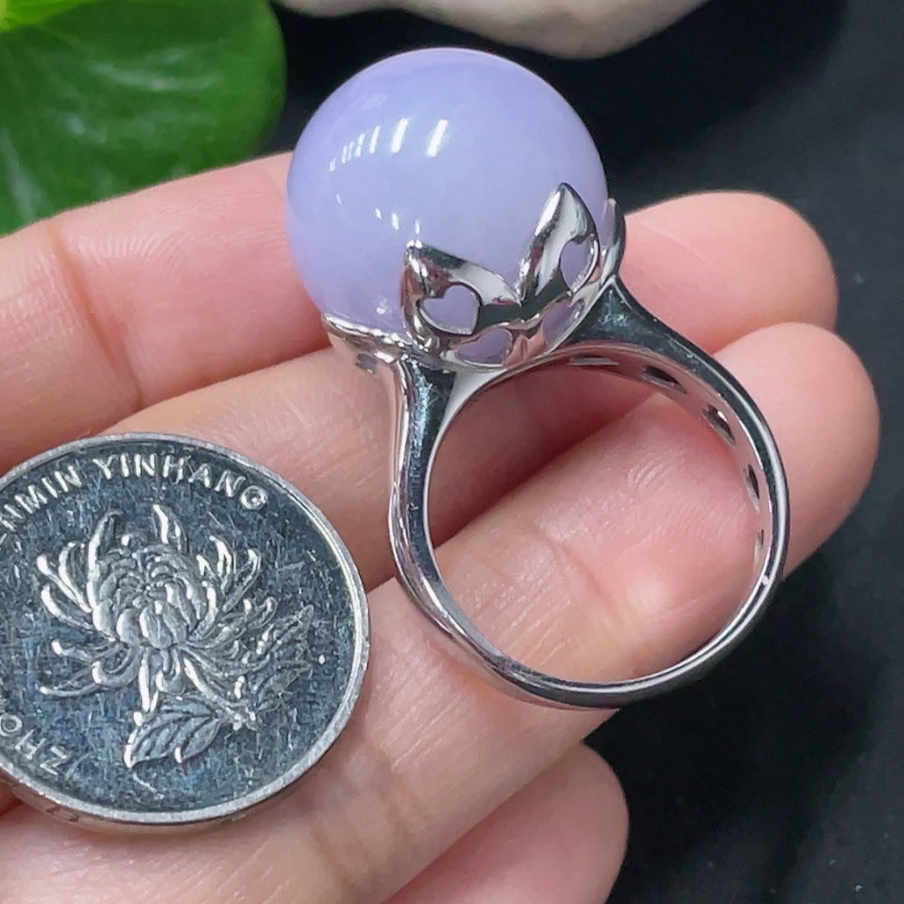 Huiliu Jadeite inlaid ring featuring intricate jade design and polished silver band, certified by Huiliu HQ.