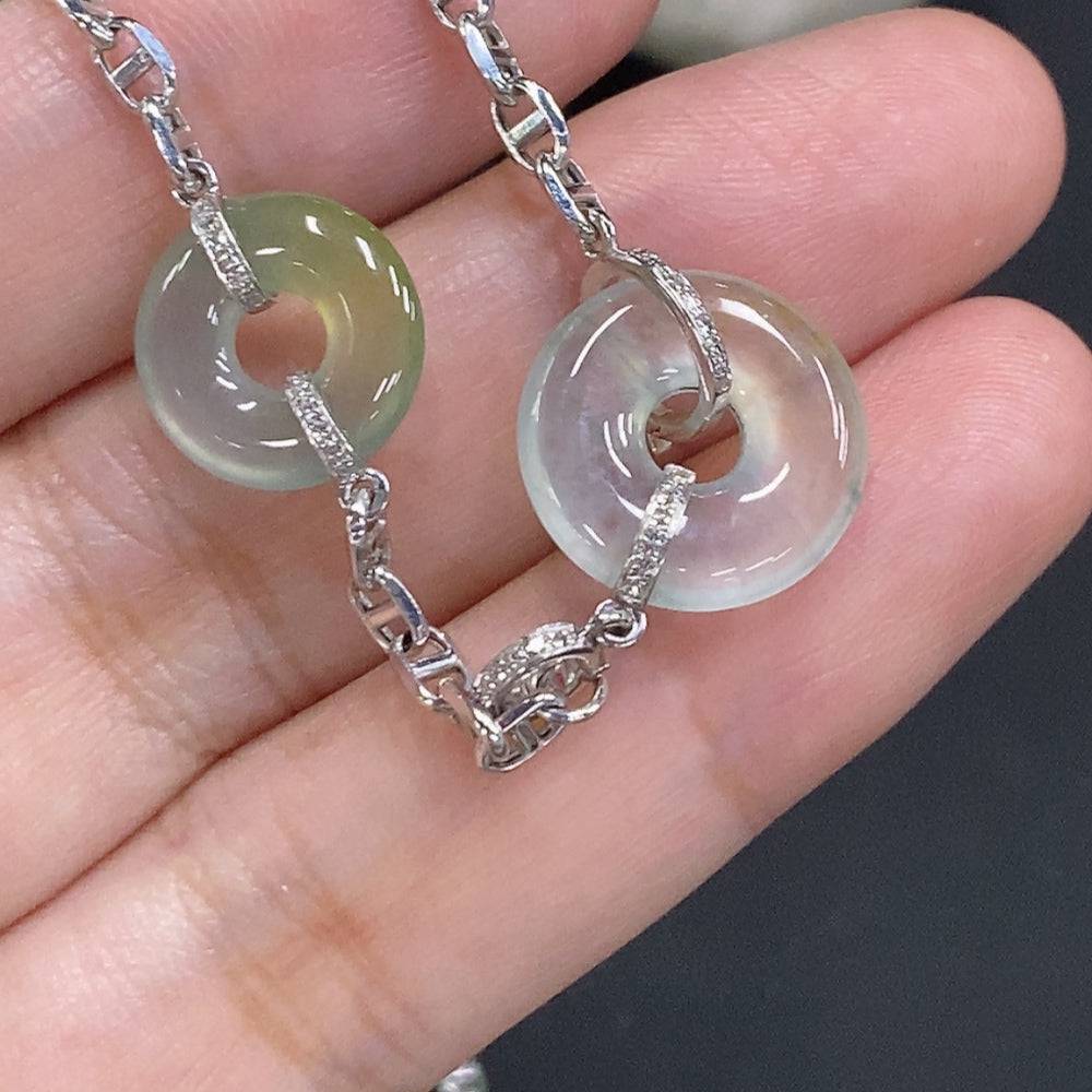 Jadeite safety buckle necklace with 18K gold and diamond accents, featuring a jade pendant on a gold chain.