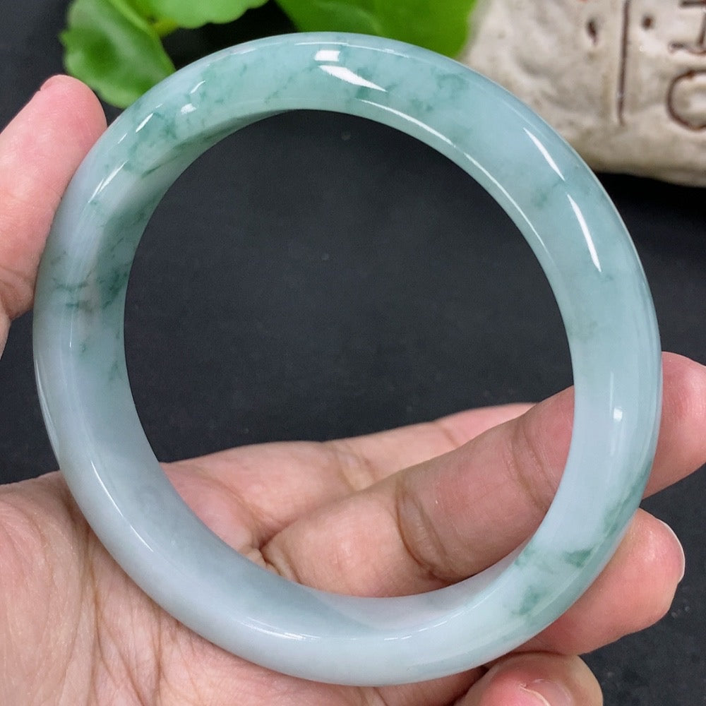Jadeite round bangle in size 59.2mm with a total weight of 57.62g, crafted by HKHQ, featuring smooth, polished jade surface.