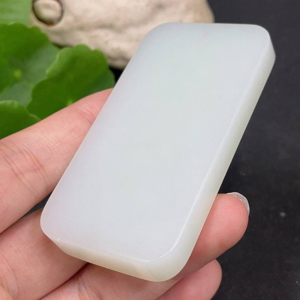 Huiliu certified Hetian Jade Guanyin pendant showcasing detailed carved Buddhist figure with smooth, polished surface.