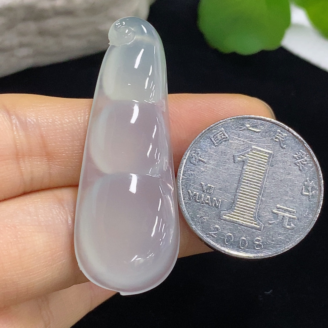 Jadeite pendant with Fu Dou design, weighing approximately 9.8g, crafted by HKHQ, featuring smooth green jade surface and intricate details.