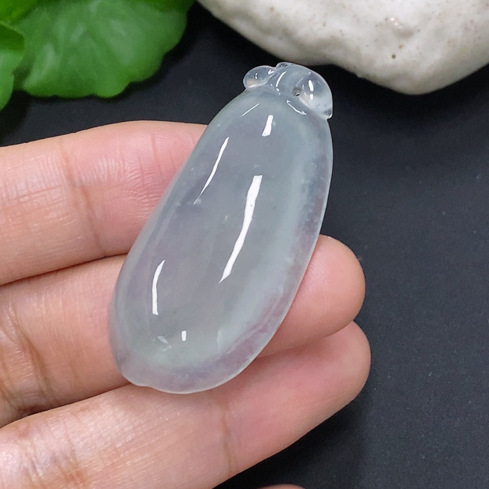 Jadeite auspicious gourd pendant from HUILIU HQ featuring a smooth, polished jade surface with intricate carvings, hanging from a cord.