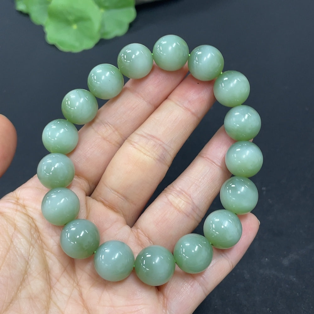 Hetian jade bracelet with 11.6mm beads and 43g weight, showcasing smooth, polished green jade stones from HKHQ.