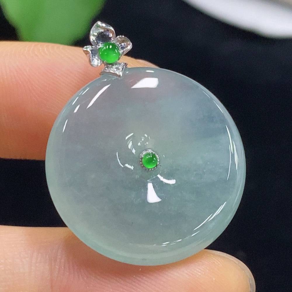 Jadeite pendant featuring a peace knot design with diamond accents, crafted by HUILIU HQ, weighing approximately 7.05g.