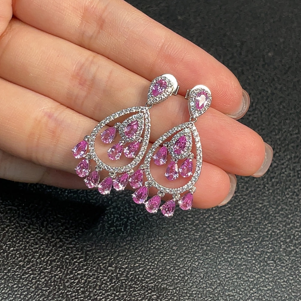 HUILIU HQ blue sapphire gemstone earrings featuring vibrant, polished sapphires set in elegant jewelry design.