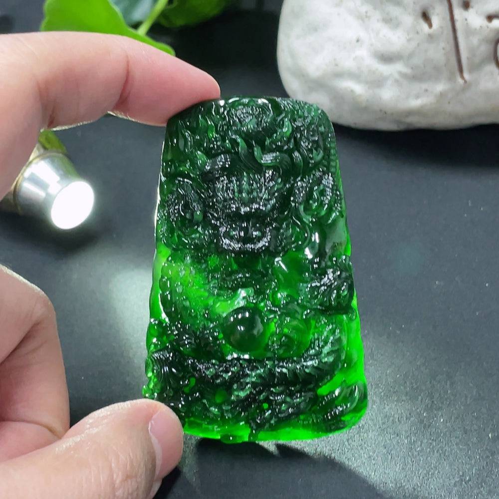 Jadeite dragon pendant weighing approximately 40g, crafted from green jade with intricate dragon design.