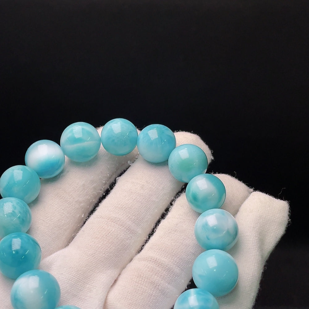 Larimar gemstone bracelet with organic matter, weighs 56.14g, 13.8mm size, by HUILIU HQ, showcasing vibrant blue stones and natural inclusions.
