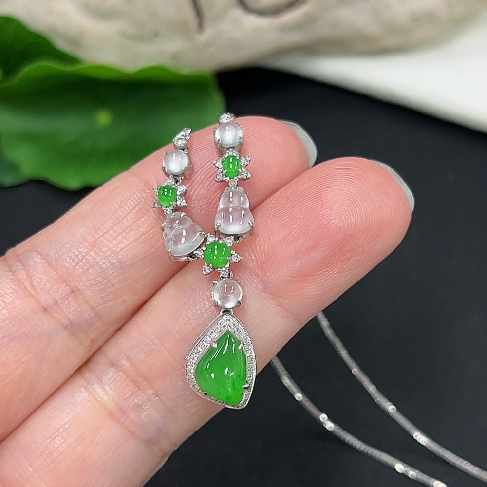 Jadeite necklace with diamond accents in 18K gold, showcasing smooth jade beads and elegant gold clasp.
