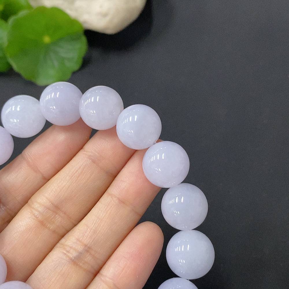 HUILIU HQ jadeite bracelet with 12.8mm beads, approximately 55g, showcasing smooth, polished green jade stones.