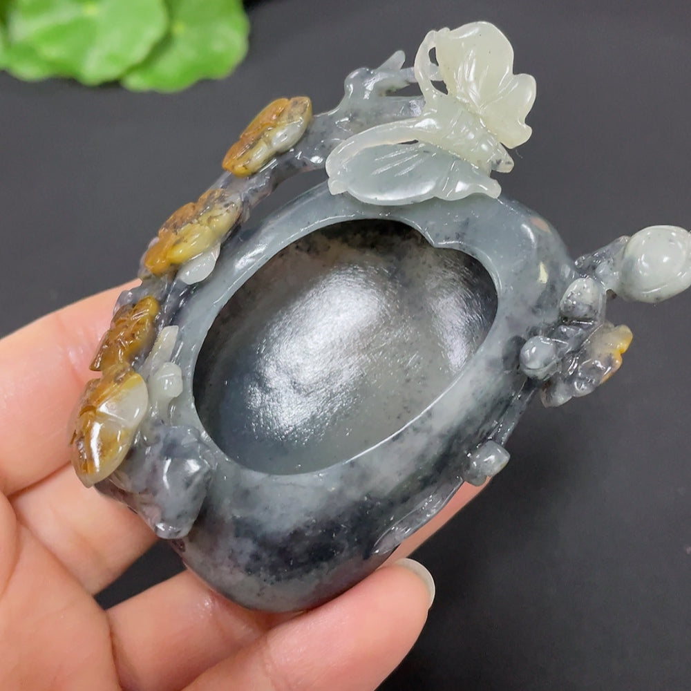 Huiliu Hetian jade butterfly and flower ornament showcasing intricate carvings and smooth, polished surface.