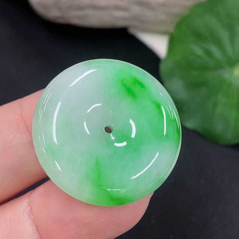 Jadeite Peace Knot pendant from HUILIU HQ, showcasing a smooth, polished jade pendant with intricate knot design.
