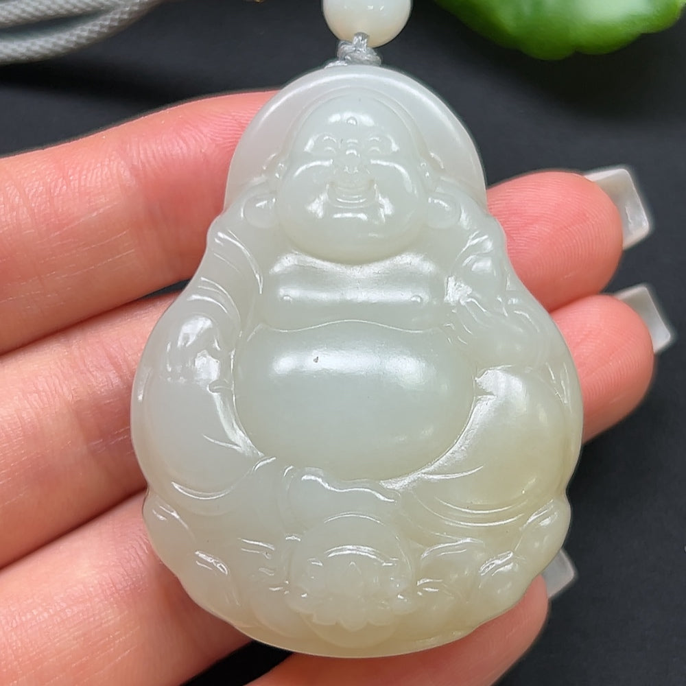 HKHQ Hetian Jade Buddha pendant with rope, approximately 50.54g, featuring detailed carved jade Buddha statue.