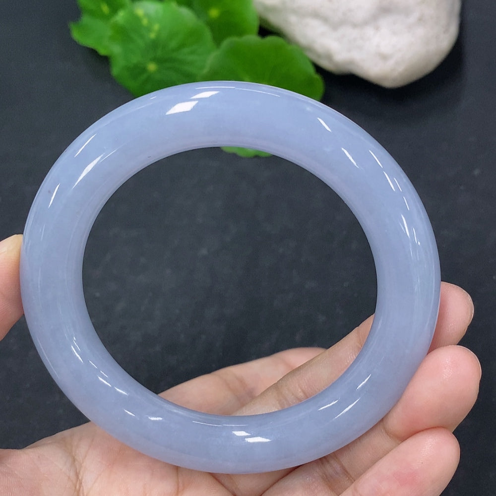Elegant jadeite round bangle bracelet by HKHQ, showcasing smooth, polished jade with a vibrant green hue.