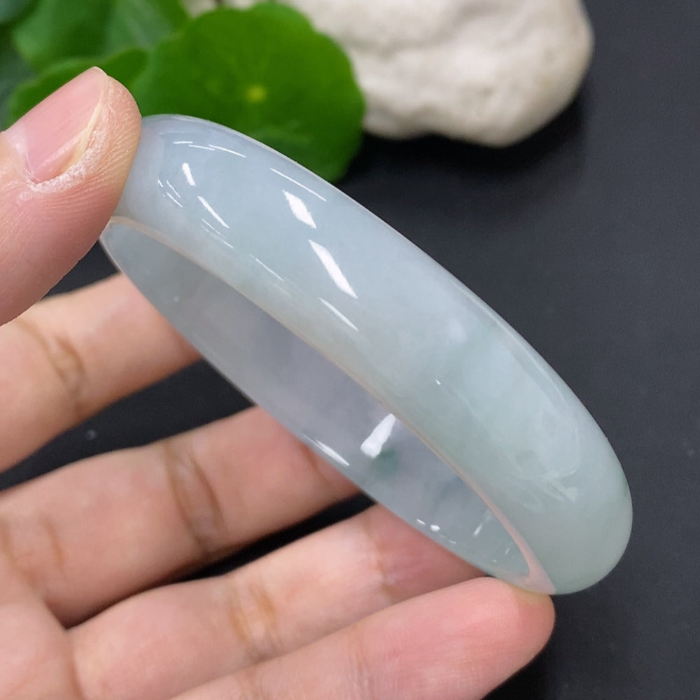 HKHQ jadeite oval bangle in size 56, weighing 43.7g, featuring a smooth, polished jadeite bracelet with a natural green hue.