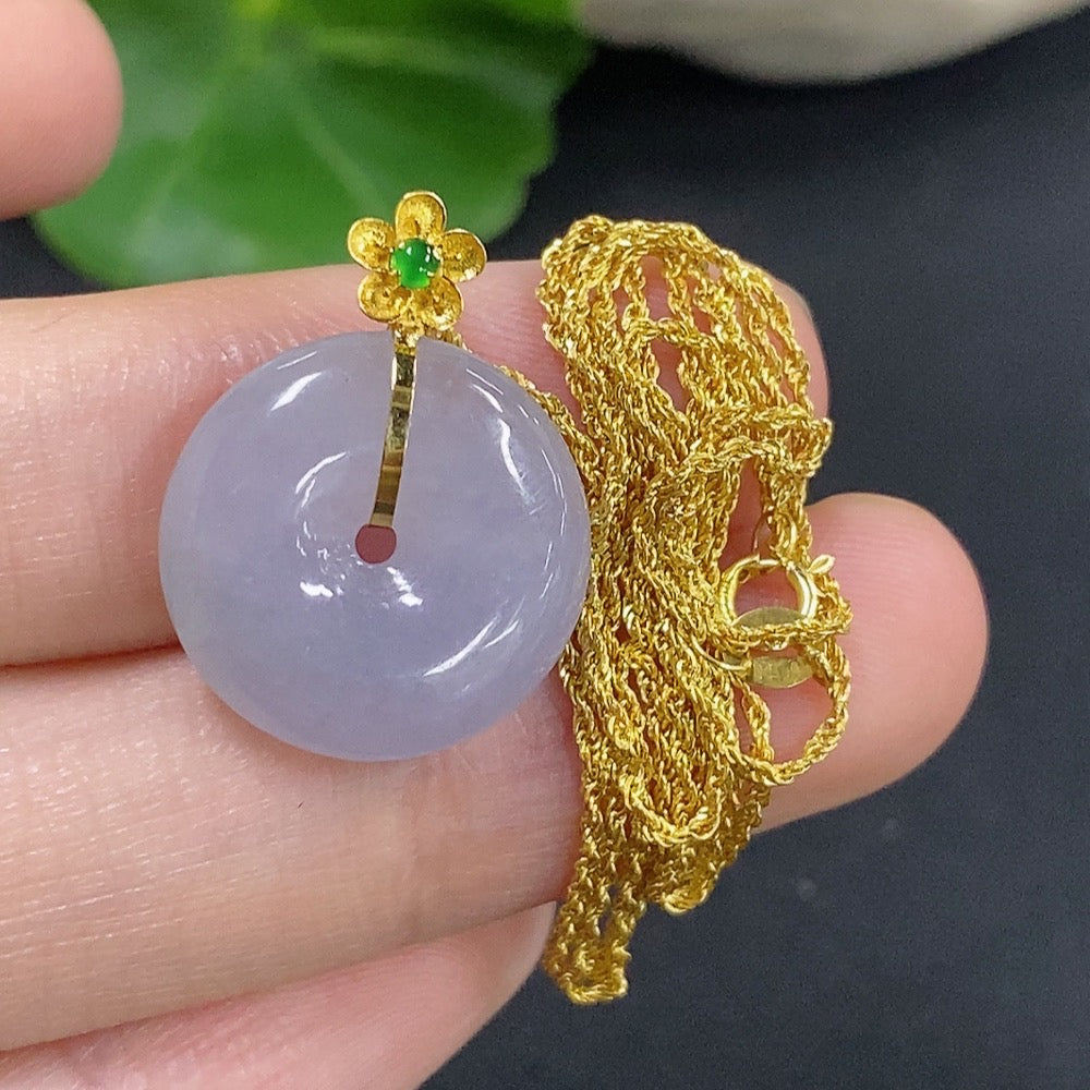 Jadeite safety buckle pendant in 18K gold with chain, showcasing a smooth, polished jade gemstone on a delicate gold chain.