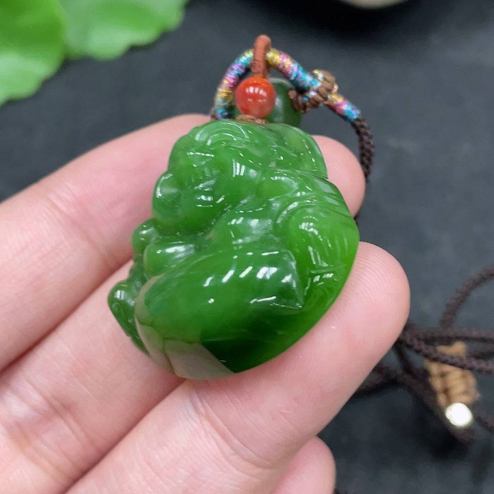 Huiliu HQ Hetian Jade Buddha pendant with rope, showcasing smooth jade carving and detailed Buddha figure on a natural cord.
