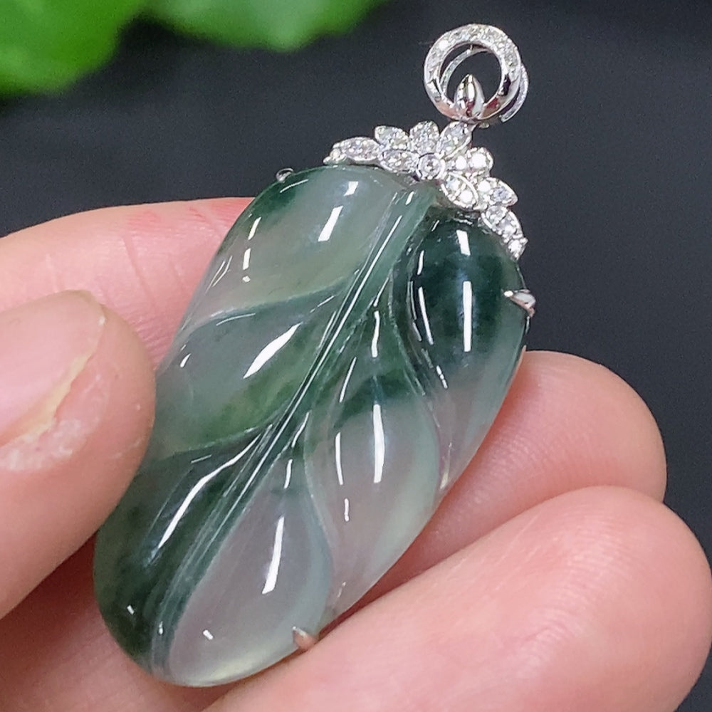 Huiliu Jadeite leaf inlay pendant with diamond accents, featuring detailed jade craftsmanship and elegant design.
