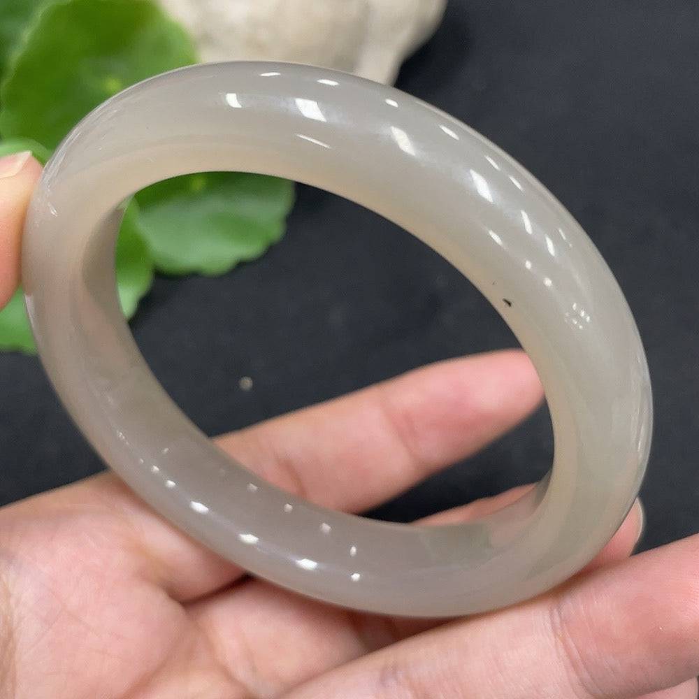 Huiliu certified Hetian jade round bracelet with smooth polished beads, showcasing natural green and cream tones.