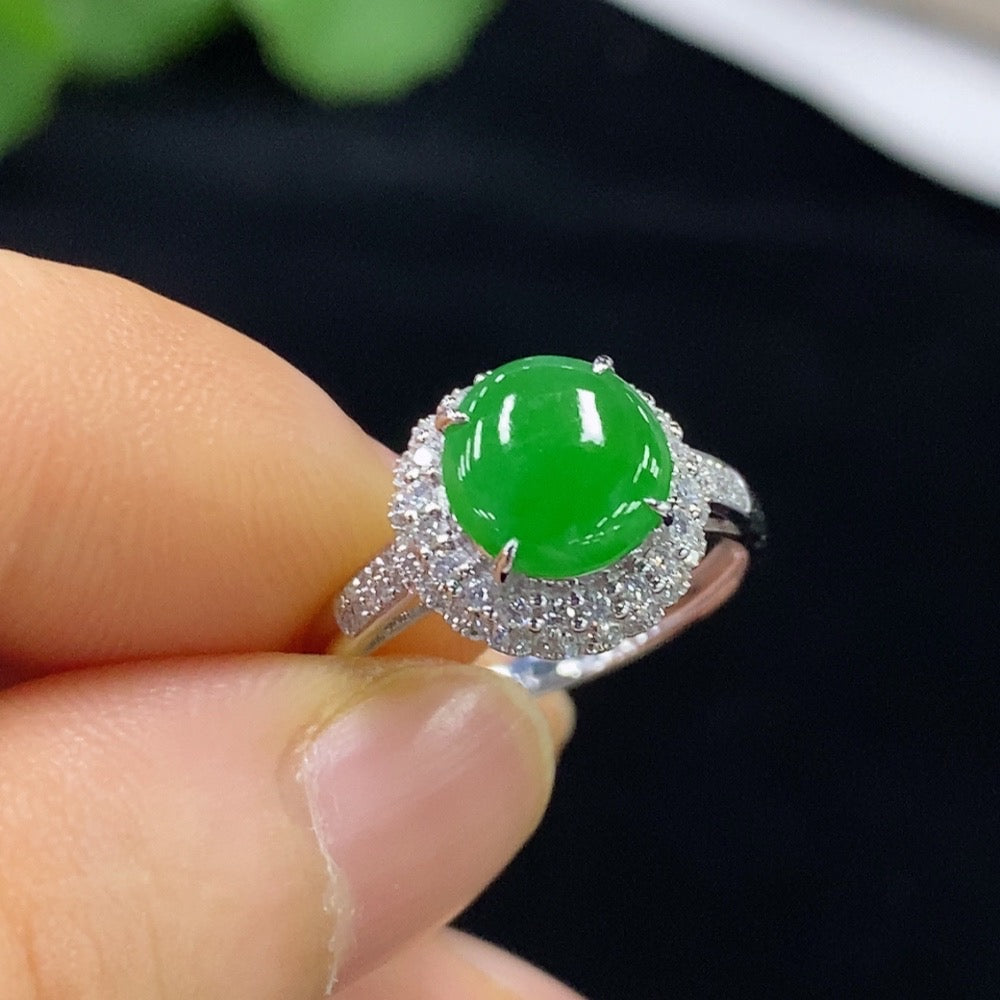 Jadeite ring with 18k gold band and diamond accents, size 14, displayed on a white background.