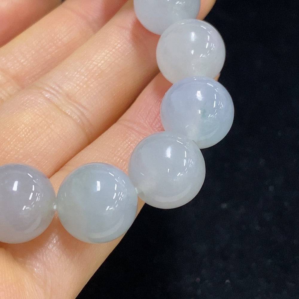 Huiliu Jadeite bracelet with 12.2mm jade beads, certified jade jewelry featuring smooth, polished green jade stones.