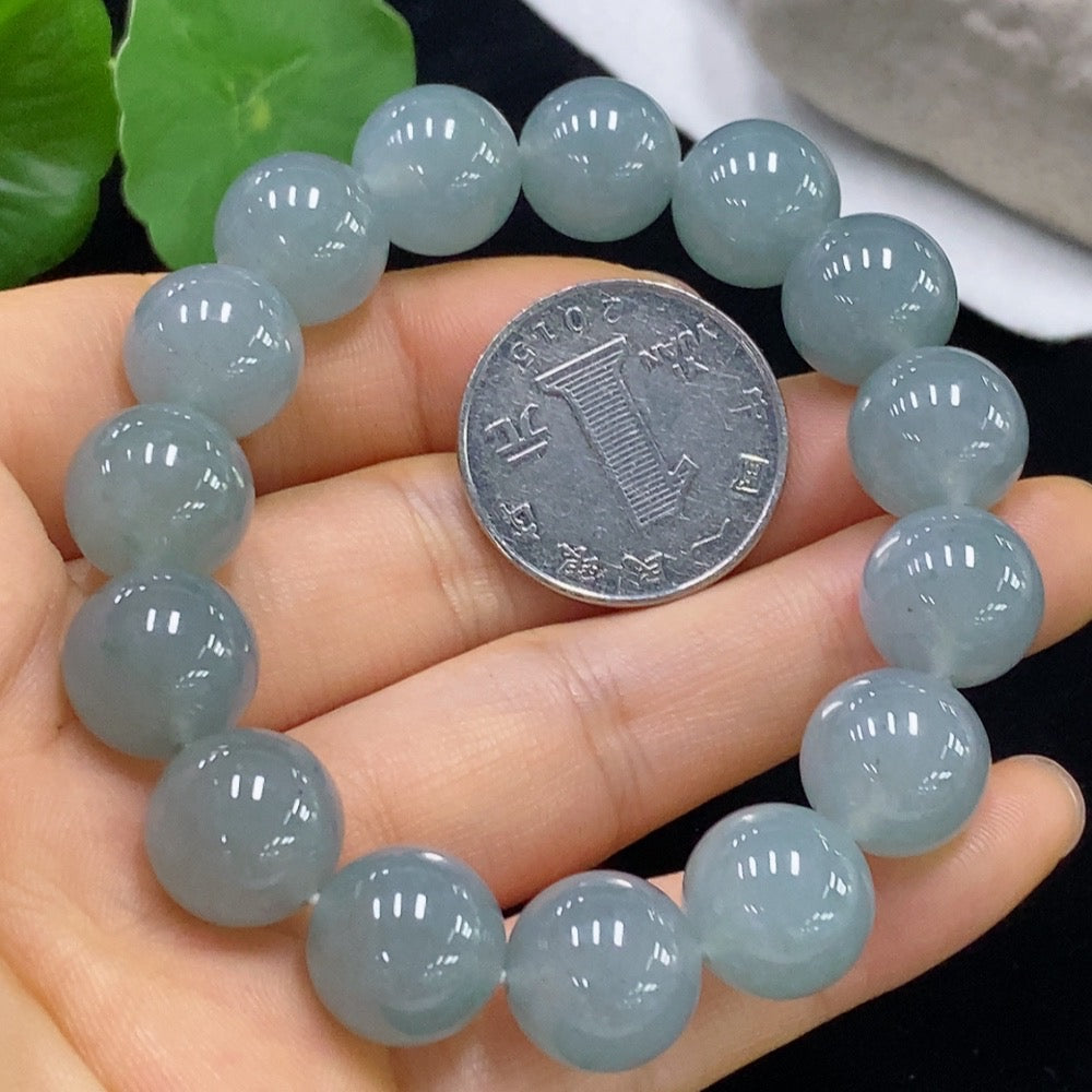 HUILIU HQ jadeite bracelet with 13mm beads, weighing approximately 58 grams, showcasing smooth, polished jade stones.