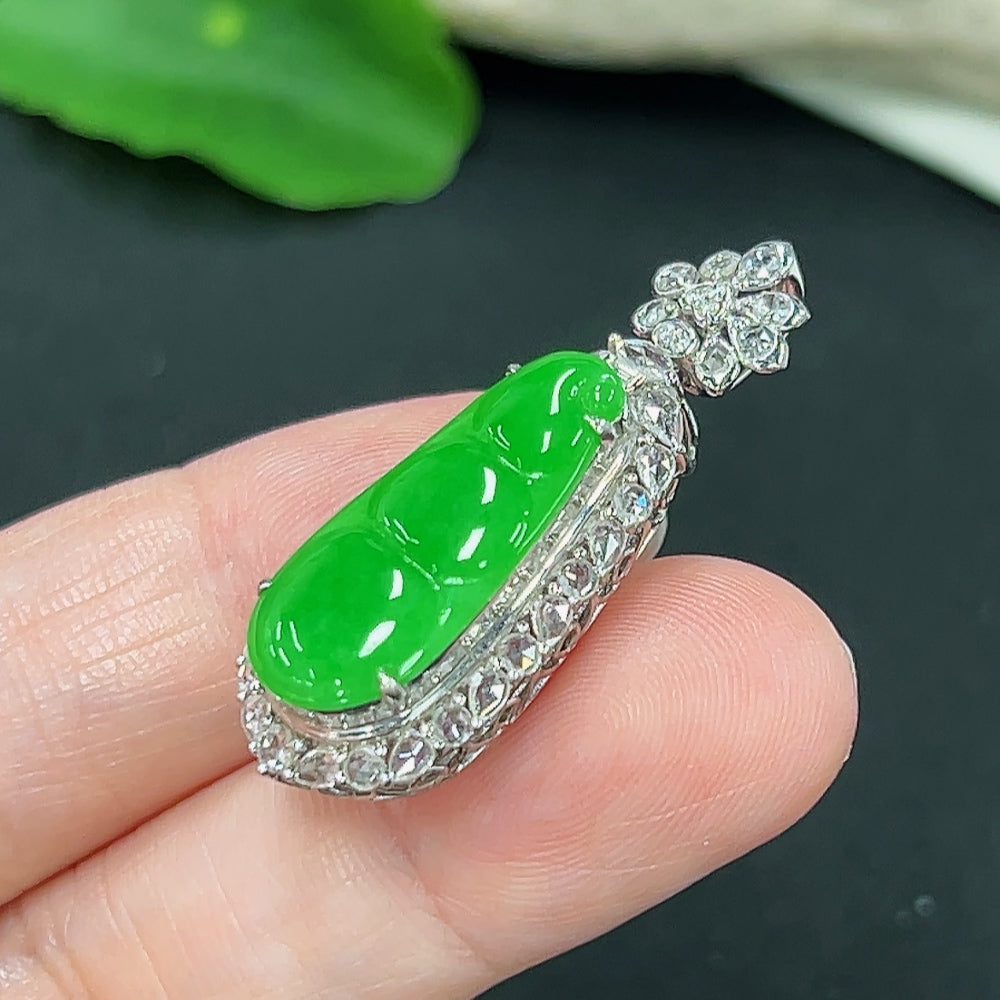 Jadeite auspicious bean pendant with diamond accents on 18K gold, crafted by HKHQ, featuring a polished jade surface and gold setting.