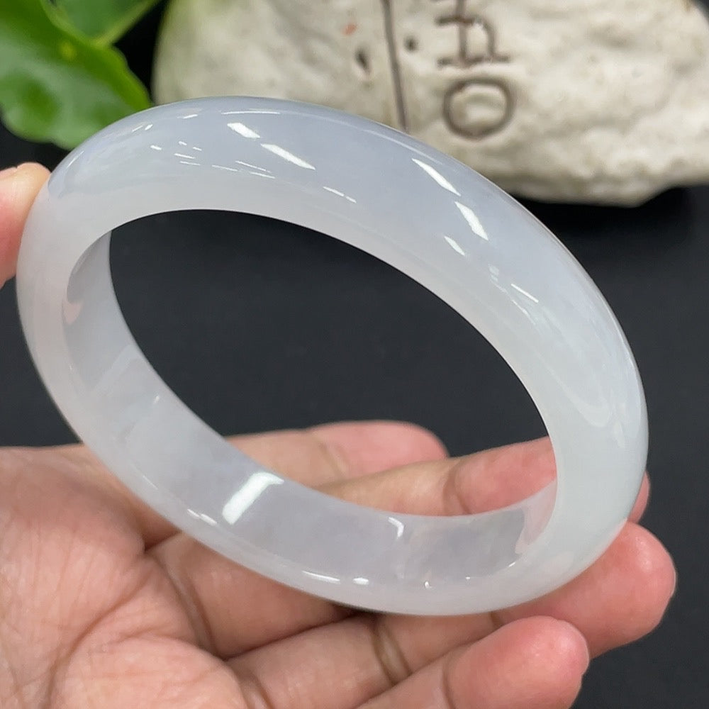 HKHQ jadeite round bangle with 57.5mm diameter, weighing approximately 58.27g, showcasing smooth, polished green jadeite surface.