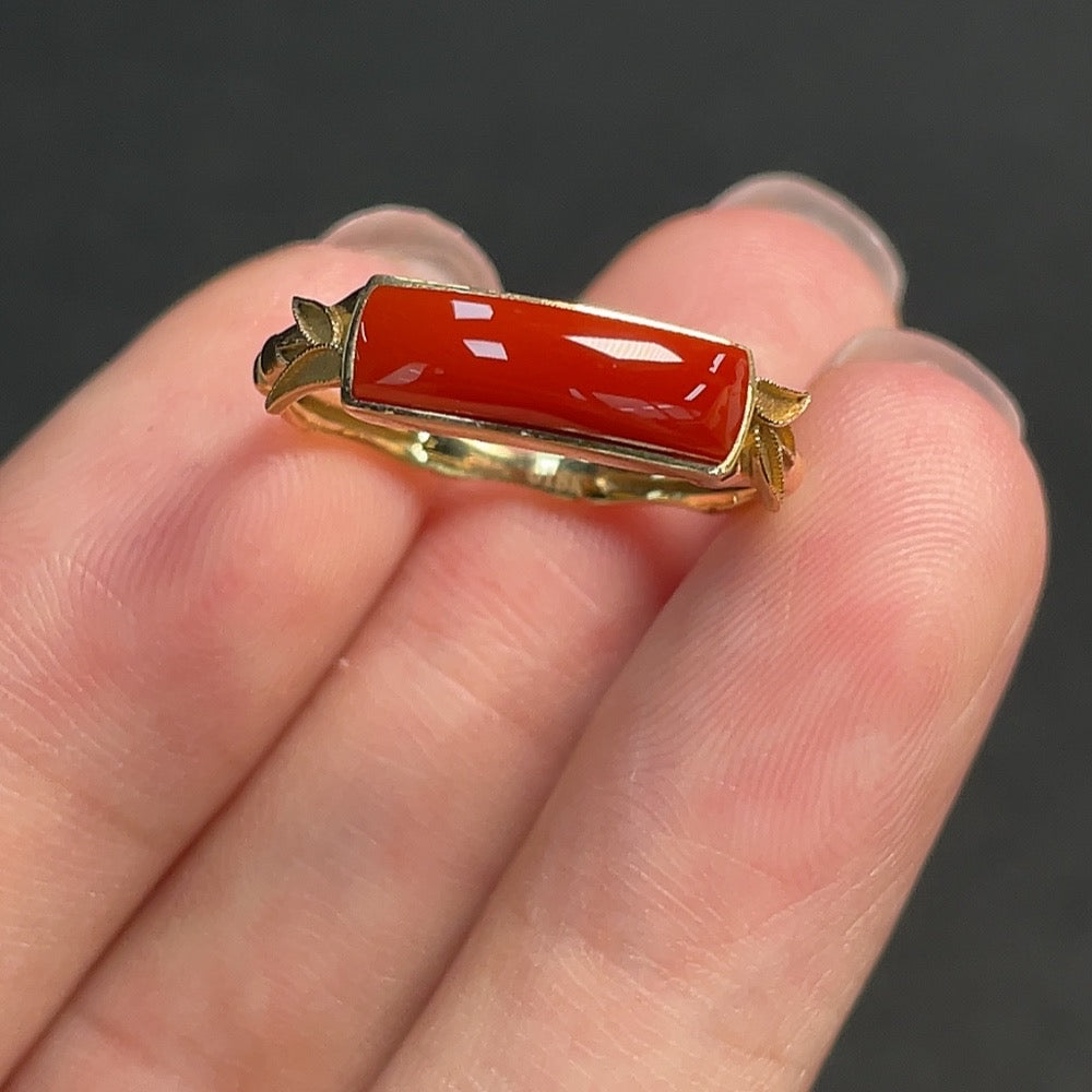 Red agate inlaid ring with 18k gold band, size 16, featuring gemstone detailing and a total weight of 2.39 grams.