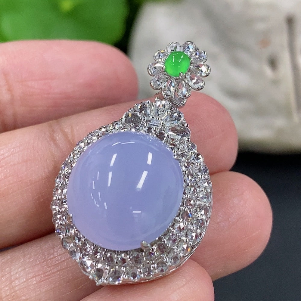Jadeite cabochon pendant with 18K gold setting and diamond accents, featuring a luxurious necklace design.