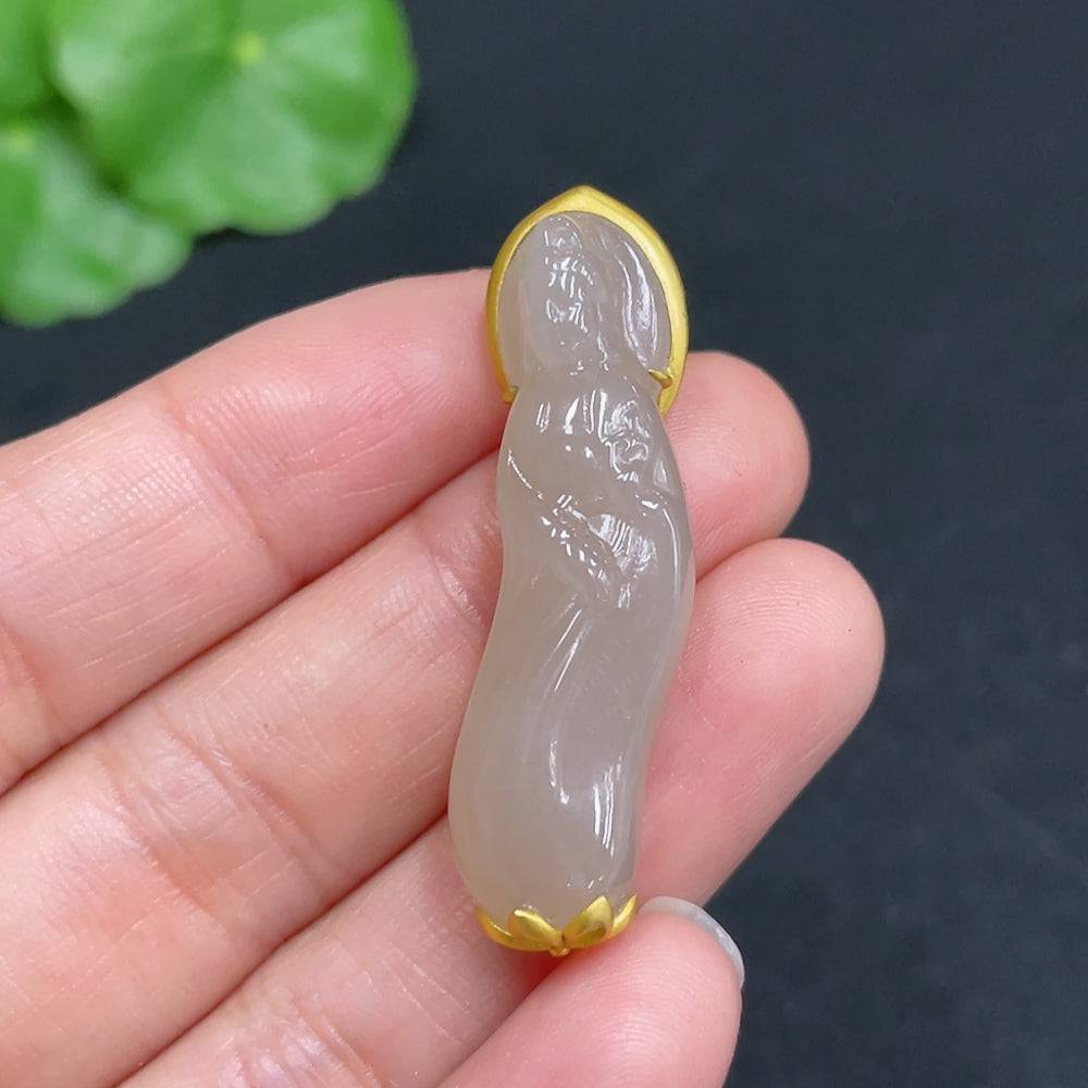 Huiliu HQ Hetian Jade Guanyin figurine with intricate inlay, showcasing detailed craftsmanship and smooth jade surface.