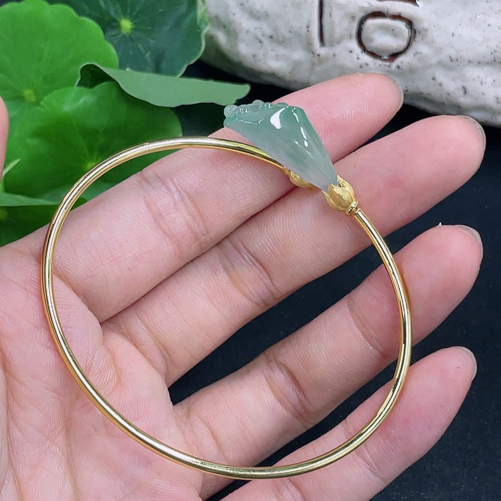 Elegant jadeite inlaid bracelet with 18K gold accents from HKHQ, showcasing intricate craftsmanship and a polished finish.