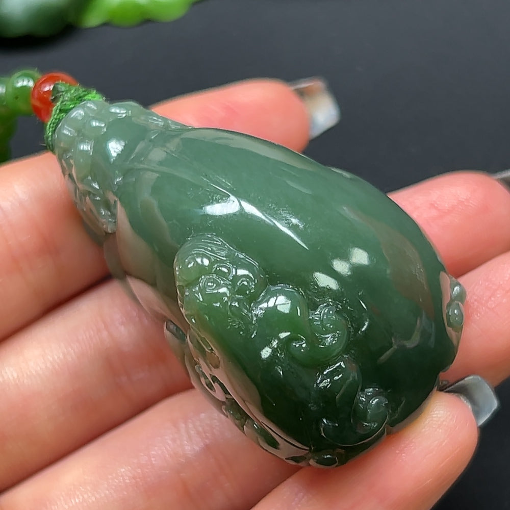 Hetian jade Pi Xiu pendant with chain, approximately 108.96g, featuring intricate carved details and glossy jade finish.