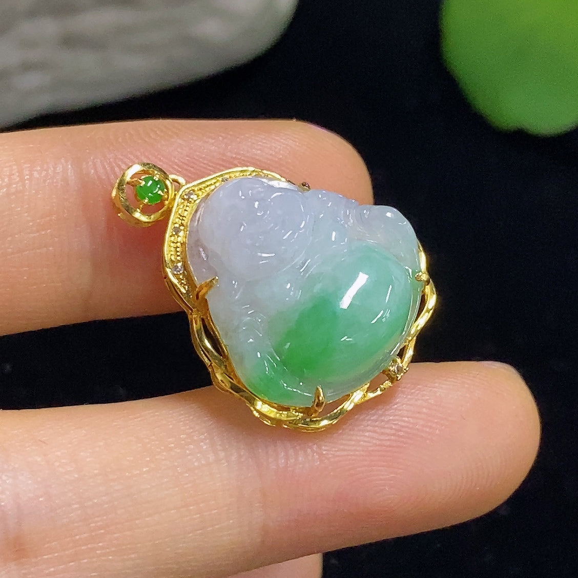 Jadeite Buddha pendant with diamond accents, inlaid with 18K gold, showcasing intricate craftsmanship and detailed design.