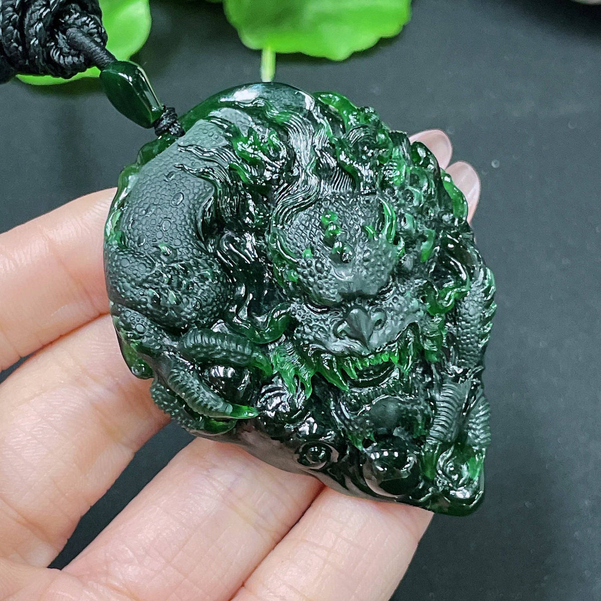 Jadeite pendant featuring a carved dragon plaque, crafted from green jade, weight approximately 49.58g, by HUILIU HQ.
