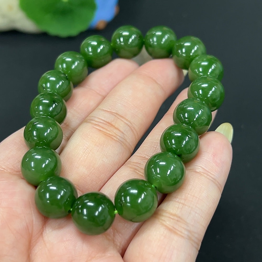 Hetian Jade Jasper bracelet with 11.8mm beads, weighing approximately 46.6 grams, featuring smooth, polished jade stones.