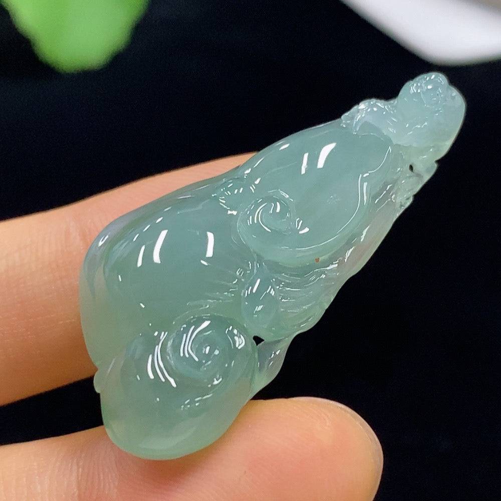 Huiliu certified jadeite Ruyi pendant with intricate carving, showcasing smooth green jade surface and detailed craftsmanship.