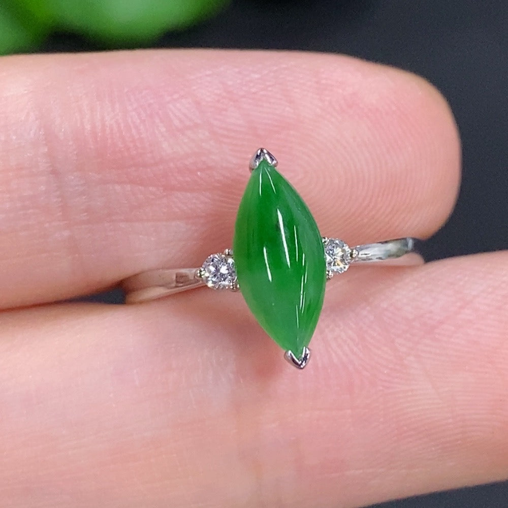Jadeite freeform ring with diamond accents in 18K gold, featuring a smooth, organic design and polished finish.