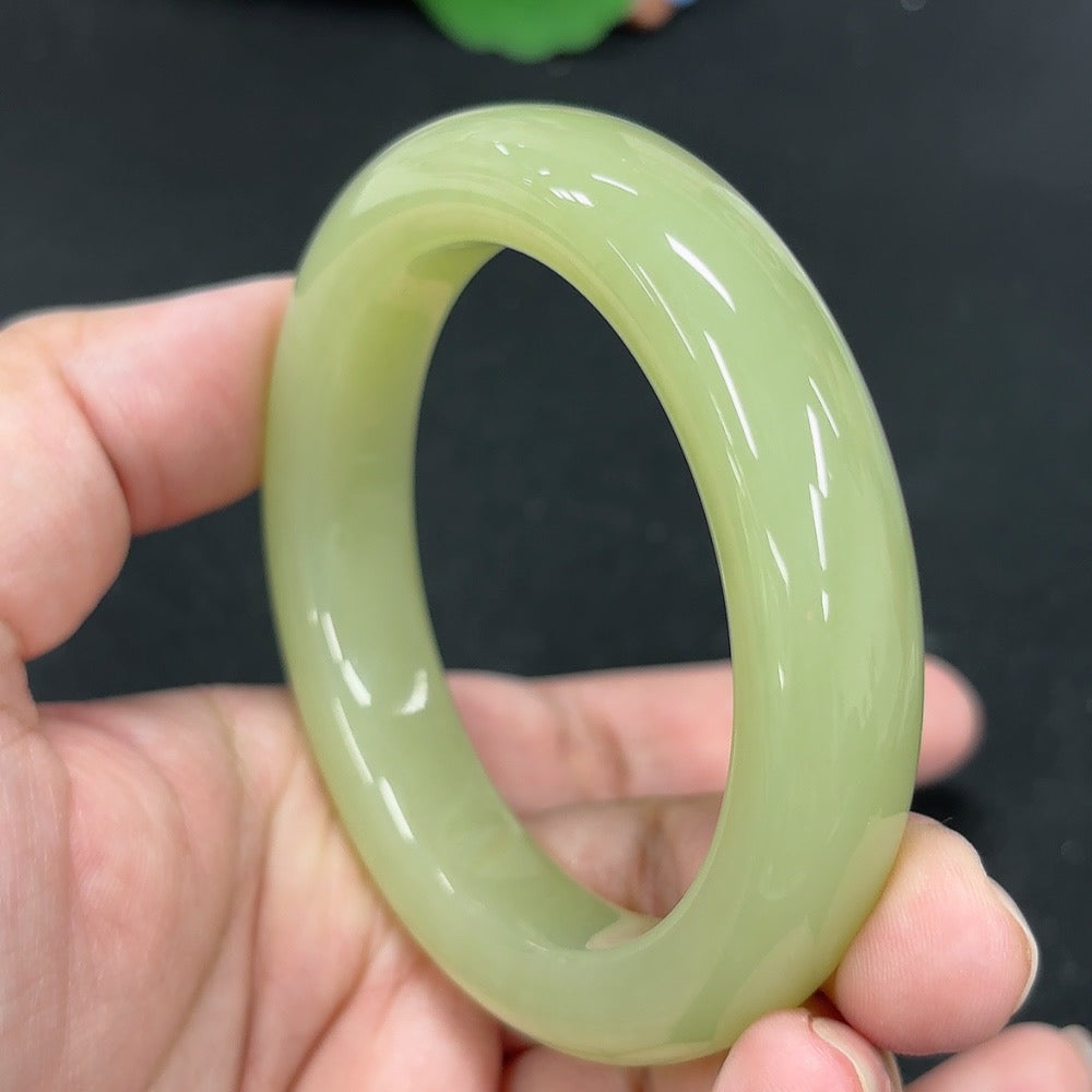 HKHQ Hetian Jade round bracelet with 7 smooth beads, size 53.1, weighing approximately 62g, showcasing elegant green jade craftsmanship.