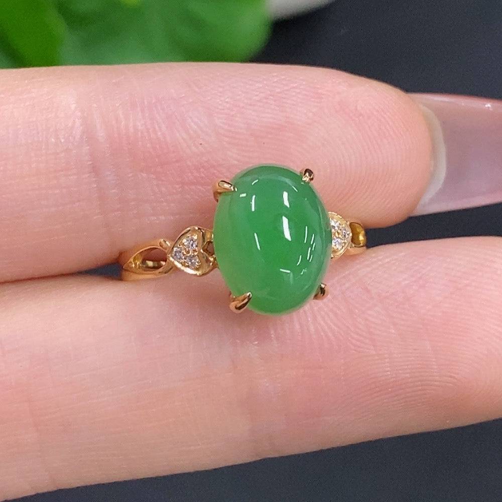 Jadeite cabochon ring with diamond accents in 18k gold, size 12, featuring a polished green jade stone and gold band.