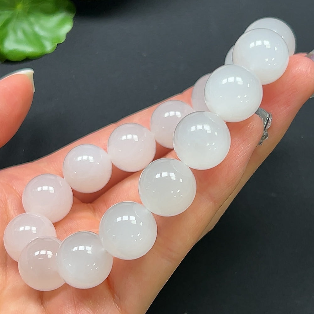 HKHQ Hetian Jade bracelet with 14mm smooth, polished jade beads, showcasing elegant, natural green tones and craftsmanship.