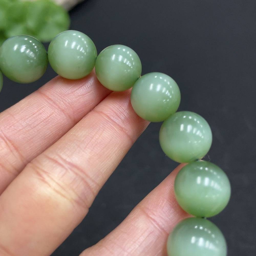 Hetian jade jasper bracelet with 11.7mm beads and 44.6g weight, featuring natural jade stones and crafted by HUILIU HQ.